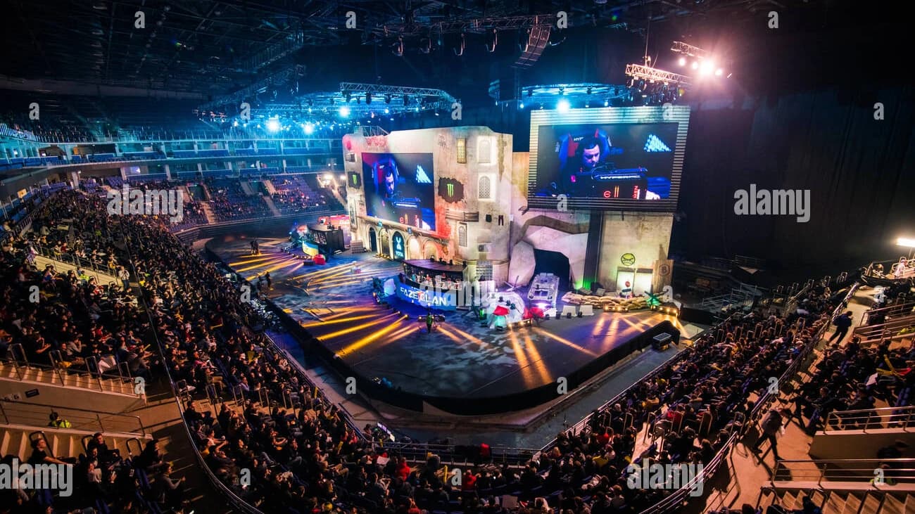 Esports arena stage with live tournament action and digital sports sponsorship branding - World Sports Advertising