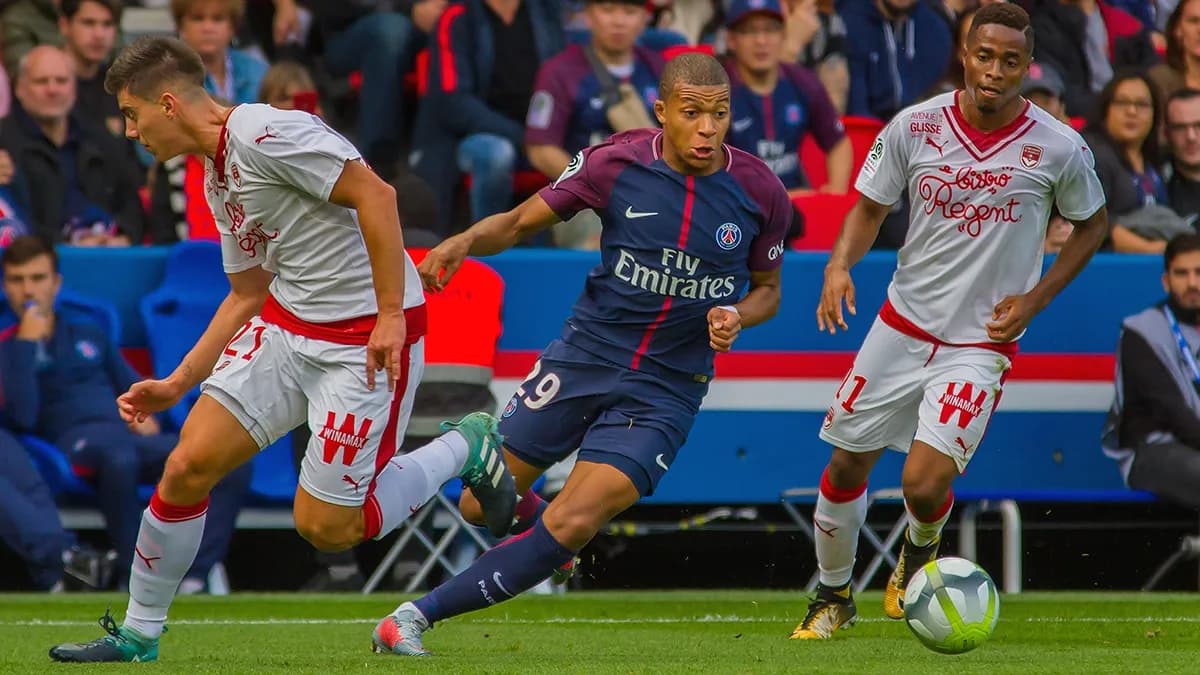 Ligue 1 French football crowd with club kit sponsorship and sports advertising - World Sports Advertising